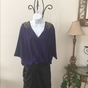 A true purple blouse with decorative sequins Sz S
